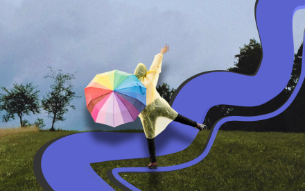 Grått väder, en person med regnbågsfärgat paraply gör ett hopp