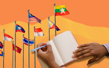 Flaggor från olika nationer, person skriver i ett anteckningsblock