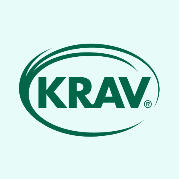 Krav-märket logotyp mot ljusgrön bakgrund